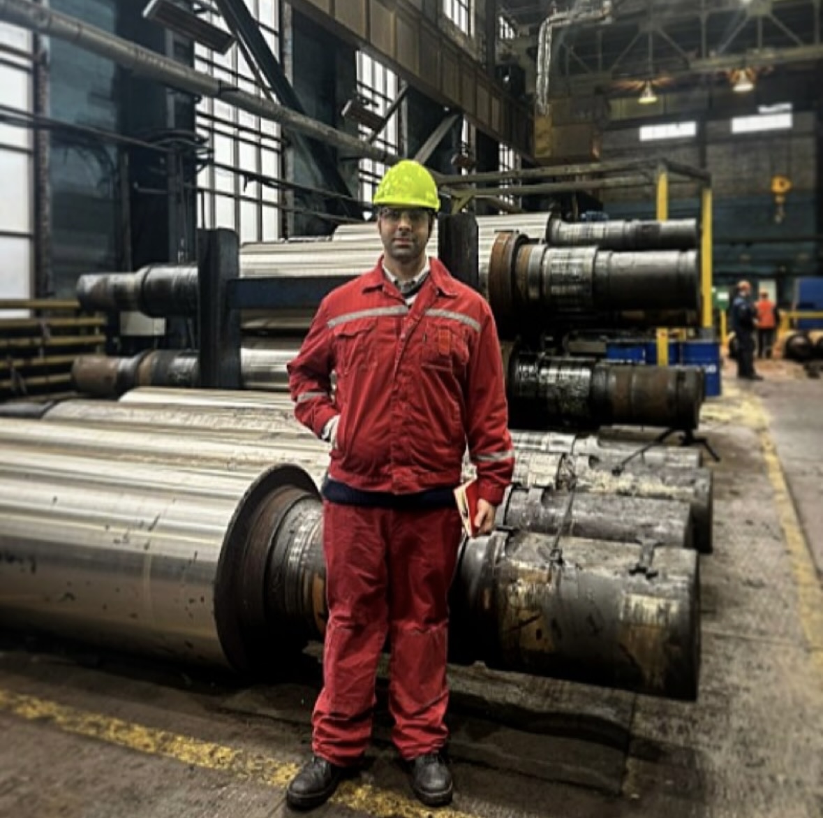 Sinan Caglayan inspecting rolling mill rolls in client roll shop
